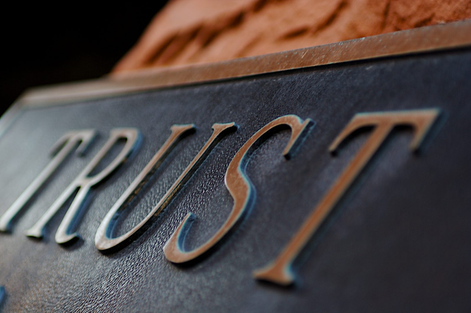 Image of a plaque with trust written