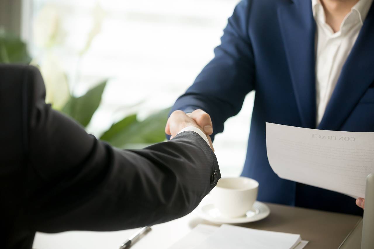 Image of Businessmen shaking hands