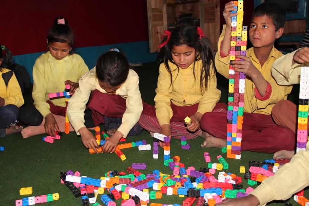 Image of kids in Nepal playing with blocks